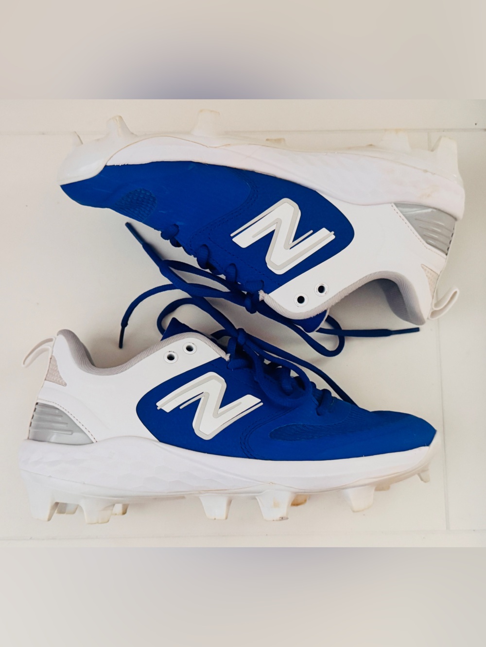 New Balance Blue and White Cleats